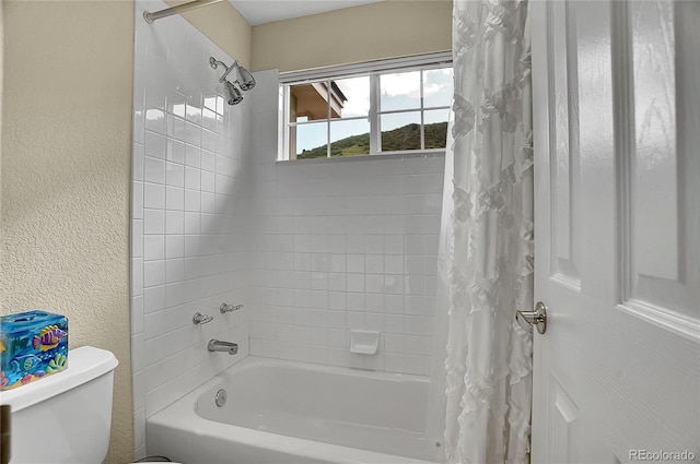 165 Washington St, Golden, CO 80403 - bathroom with shower / bath combination with curtain, toilet, and a textured wall