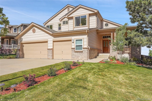 165 Washington St, Golden, CO 80403 - view of front facade featuring driveway, brick siding, and a front lawn