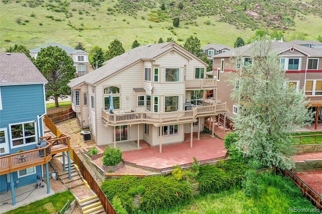 165 Washington St, Golden, CO 80403 - back of property with a patio area, stairway, a deck, and central AC