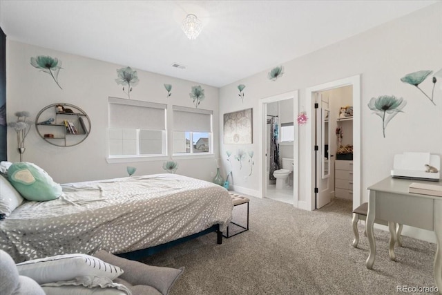 27250 E Nova Cir, Aurora, CO 80016 - bedroom featuring carpet floors, a spacious closet, ensuite bathroom, and baseboards