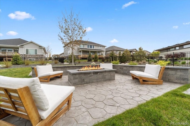 27250 E Nova Cir, Aurora, CO 80016 - view of patio featuring an outdoor fire pit, a residential view, and fence