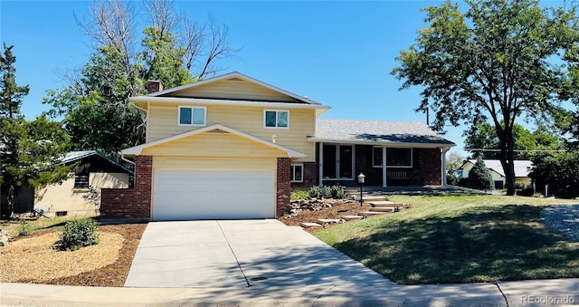 split level home featuring a front lawn