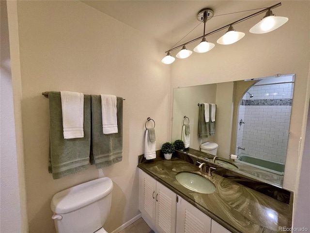 bathroom featuring vanity, toilet, and tiled shower