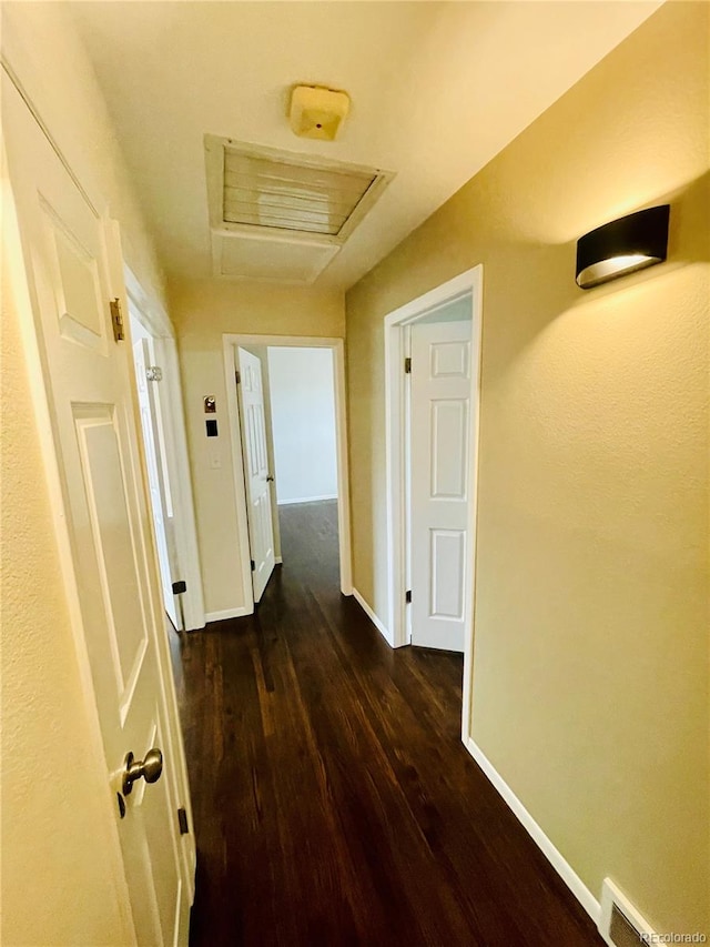 hall with dark hardwood / wood-style flooring