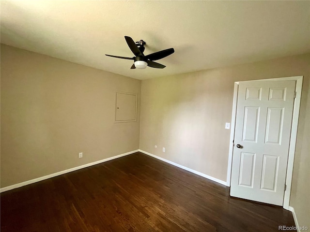 unfurnished room featuring ceiling fan and dark hardwood / wood-style floors