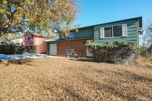 back of house with a garage