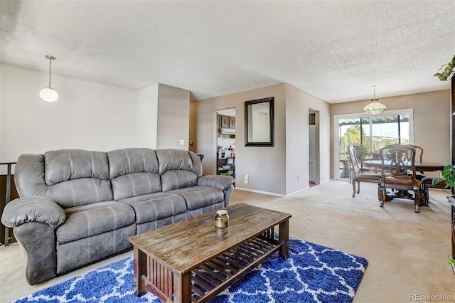 carpeted living room with a textured ceiling