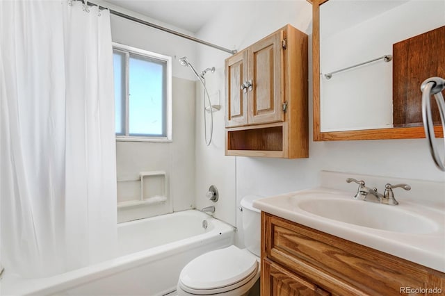 full bathroom featuring shower / bath combo with shower curtain, vanity, and toilet