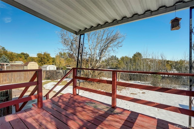 deck featuring a shed