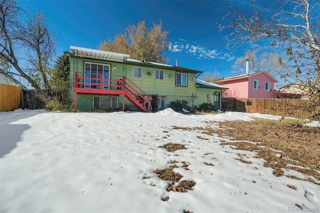 view of snow covered house