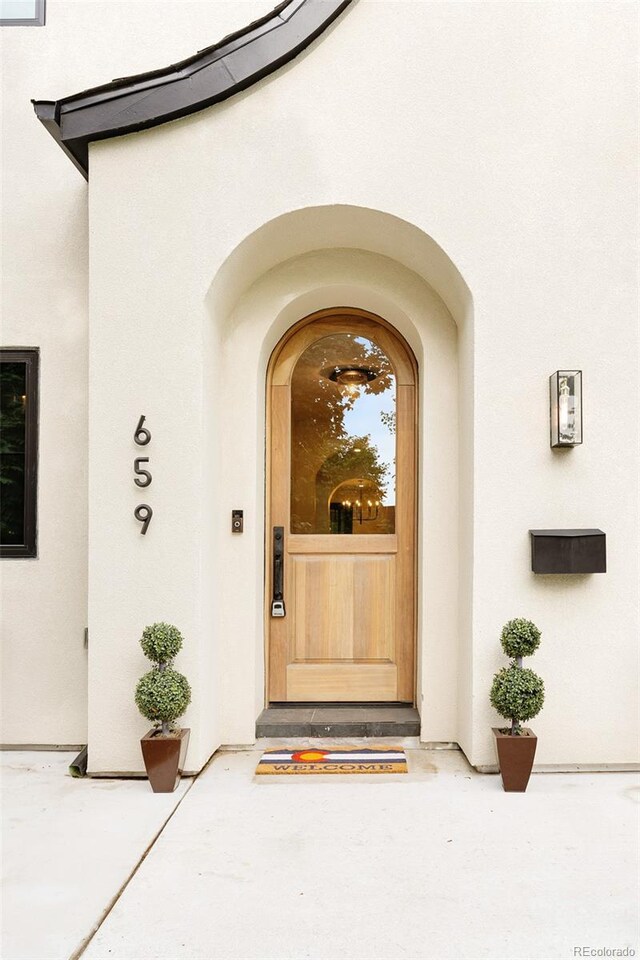 659 Albion St, Denver, CO 80220 - view of exterior entry with stucco siding