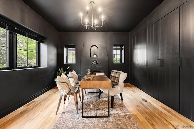 659 Albion St, Denver, CO 80220 - dining room featuring light wood-style floors, a chandelier, and plenty of natural light