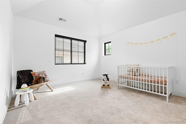659 Albion St, Denver, CO 80220 - unfurnished bedroom featuring lofted ceiling, carpet floors, a crib, and baseboards