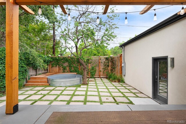 659 Albion St, Denver, CO 80220 - fenced backyard featuring a deck and a patio