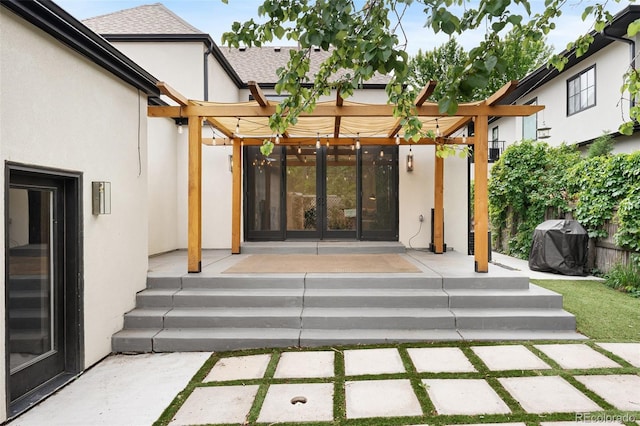 659 Albion St, Denver, CO 80220 - entrance to property with stucco siding, a pergola, and a shingled roof