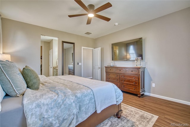 bedroom with baseboards, wood finished floors, and ceiling fan