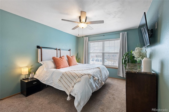 bedroom with carpet floors, a ceiling fan, and baseboards