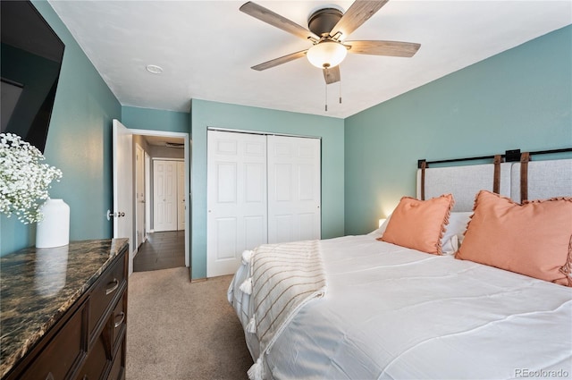 bedroom with light carpet, a ceiling fan, and a closet