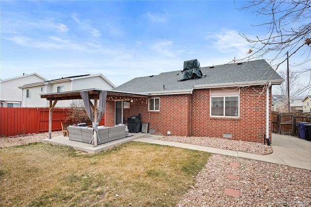 back of house with crawl space, a patio area, an outdoor hangout area, and brick siding