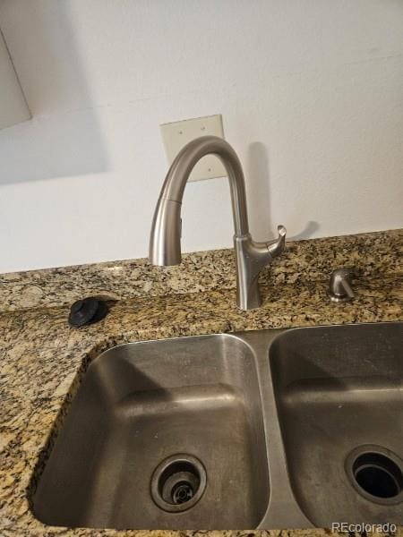 1304 S Parker Rd Unit 13, Denver, CO 80231 - kitchen view of a sink and stone countertops