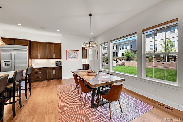 6639 S Vandriver Way, Aurora, CO 80016 - dining room with plenty of natural light, light wood-style floors, recessed lighting, and a chandelier