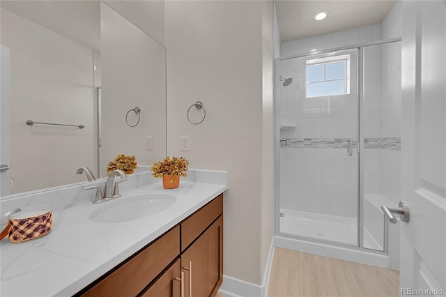 6639 S Vandriver Way, Aurora, CO 80016 - bathroom featuring vanity and a stall shower