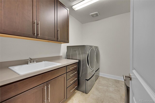 6639 S Vandriver Way, Aurora, CO 80016 - laundry room featuring washer and dryer and cabinet space