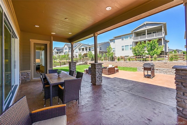 6639 S Vandriver Way, Aurora, CO 80016 - view of patio featuring a grill, a residential view, and outdoor dining area