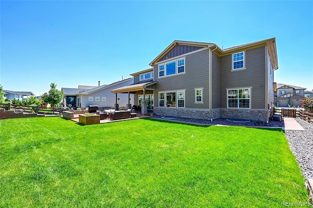 6639 S Vandriver Way, Aurora, CO 80016 - rear view of property with outdoor lounge area, a patio, board and batten siding, and stone siding