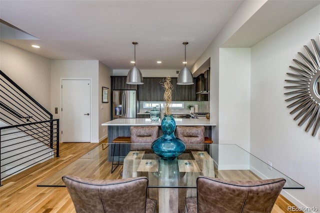3408 W 18th Ave, Denver, CO 80204 - dining space with light wood-type flooring, stairway, and recessed lighting