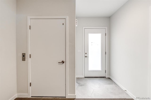3408 W 18th Ave, Denver, CO 80204 - entryway featuring baseboards and light tile patterned floors