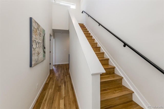 3408 W 18th Ave, Denver, CO 80204 - staircase with wood finished floors and a high ceiling