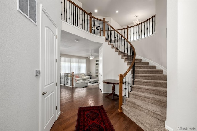 27029 E Irish Pl, Aurora, CO 80016 - stairs with a chandelier, wood finished floors, baseboards, a ceiling fan, and recessed lighting