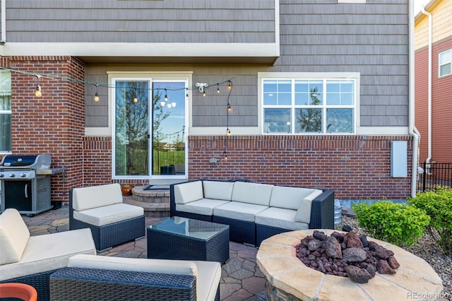 27029 E Irish Pl, Aurora, CO 80016 - view of patio / terrace with a grill and an outdoor living space with a fire pit