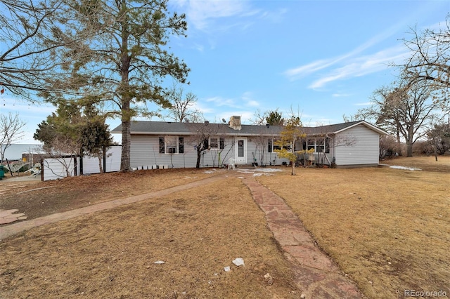 single story home with a garage and a front lawn