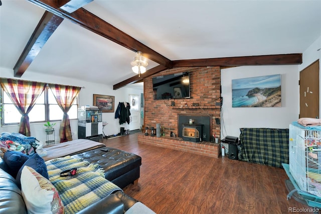 living room featuring beamed ceiling, ceiling fan, a brick fireplace, hardwood / wood-style floors, and brick wall