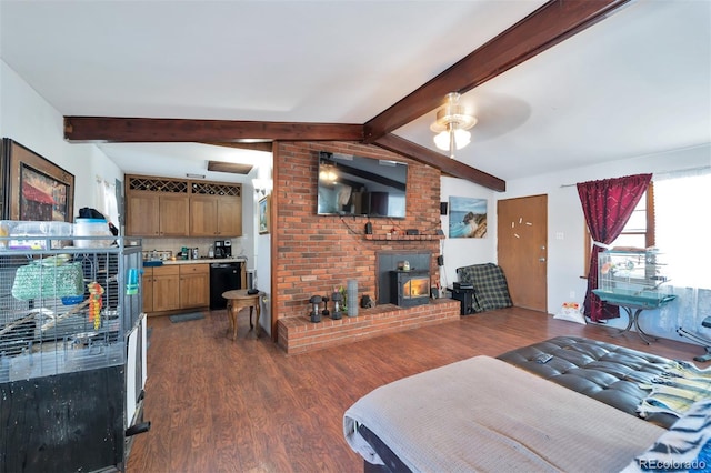 interior space featuring a brick fireplace, ceiling fan, brick wall, beam ceiling, and hardwood / wood-style floors