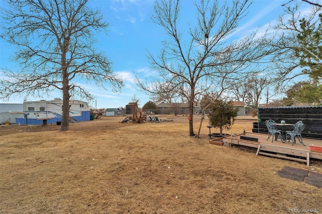 view of yard featuring a wooden deck