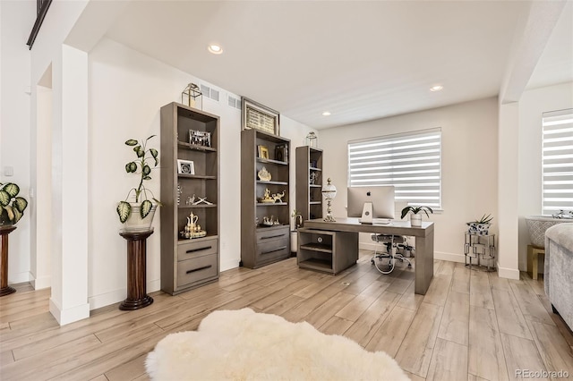 office space with light wood-type flooring