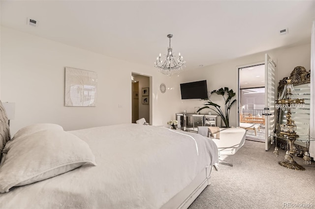 bedroom featuring carpet floors and a notable chandelier