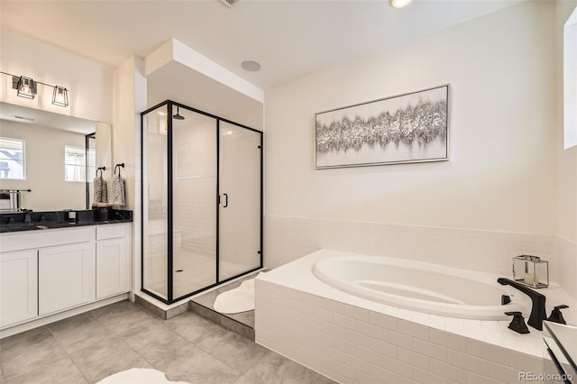 bathroom with tile patterned floors, vanity, and plus walk in shower