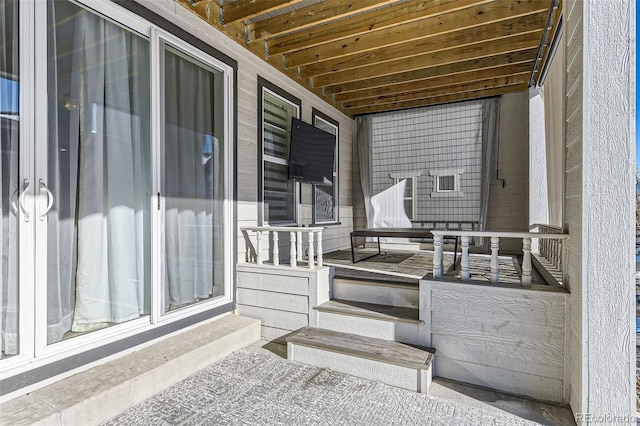 view of patio featuring a porch