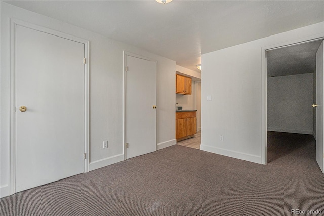 interior space featuring light colored carpet