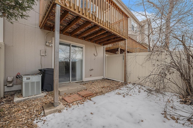 exterior space featuring central AC unit and a deck