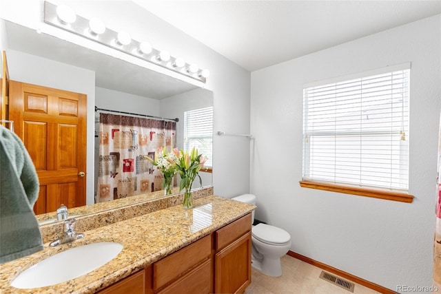 13180 Jasmine St, Thornton, CO 80602 - full bath featuring vanity, toilet, baseboards, and curtained shower