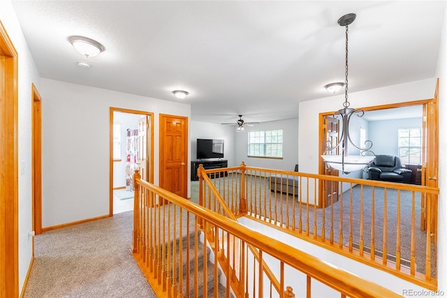 13180 Jasmine St, Thornton, CO 80602 - hallway featuring an upstairs landing, carpet floors, and baseboards