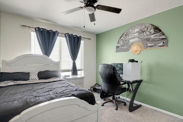 carpeted bedroom with baseboards and ceiling fan