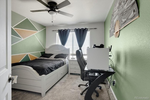 bedroom featuring carpet flooring, ceiling fan, and a textured wall