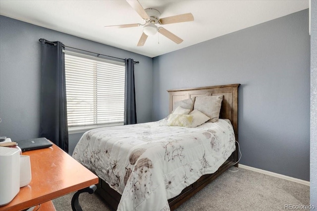 bedroom with carpet flooring, a ceiling fan, and baseboards