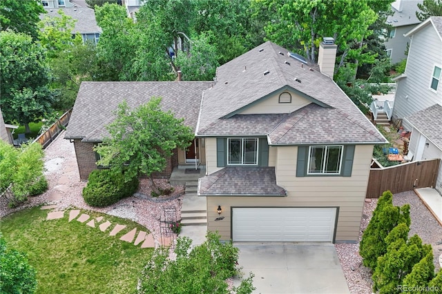 8725 Meadowlark Cir, Highlands Ranch, CO 80126 - view of front of property with a garage, roof with shingles, driveway, and a chimney